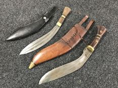Two Kukri knives in sheaths