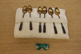 Six silver gilt black enamel spoons by David Andersen and a pair of silver two-colour enamel