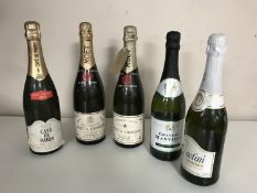 Two bottles of Moet & Chandon Dry Imperial and Premiere Cuvee champagne,