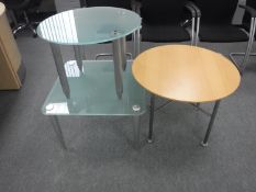 A circular pine topped reception coffee table and two glass topped coffee tables