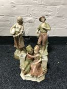 A pair of Royal Dux figures of water carriers (gentleman with chip to hat) and a Royal Dux figure