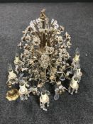 A decorative brass and glass twelve branch chandelier and a pair of similar wall lights