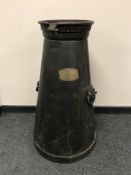 A nineteenth century cast iron milk churn, with brass plaque 