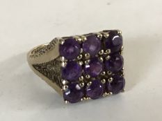 A 9ct gold and amethyst ring