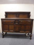 An early 20th century oak buffet back sideboard