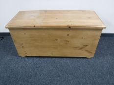 A stripped pine blanket box