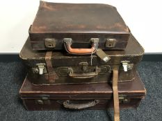 Three vintage leather luggage cases