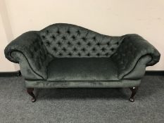 A Victorian style buttoned low settee,