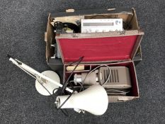 Three cased projectors together with an angle poise lamp and a box containing a pathescope