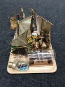 A tray of two ships in bottles and seven wooden boats