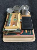 A tray of six bricks of tea and three tins of Chinese tea