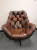 Amid 20th century brown button leather swivel chair