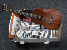 A Makala ukulele and a quantity of assorted CDs