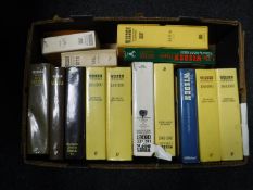 A box of Wisdon Almanacs and anthologies