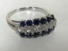 An 18ct white gold sapphire and diamond ring
