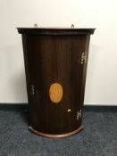 A Victorian style inlaid mahogany hanging corner cabinet