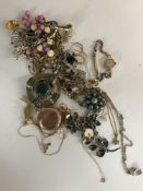 An ivorine pendant on chain stamped 14kt, a fob watch, a lady's cocktail watch,