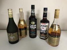 Five bottles of alcohol to include; Three bottles of Napoleon Brandy, Captain Morgan Rum,