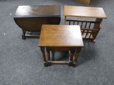 An oak drop leaf turn top coffee table,