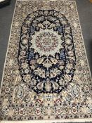 A fringed Persian Nain design rug on cream ground