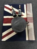 A vintage hat box together with two Perrier-Joute display champagne bottles and a contemporary rug