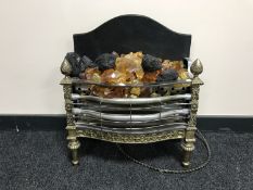 A mid 20th century brass framed electric fire with glass coals