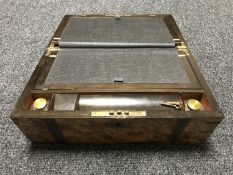 A Victorian walnut brass bound writing box
