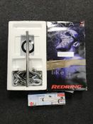 A boxed Zeta red ring electric shower together with a thermostat