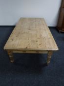 A rectangular pine farmhouse coffee table