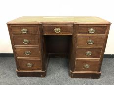 A Victorian mahogany twin pedestal desk with tooled leather top,