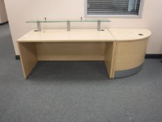 A pine effect reception desk with matching corner stand