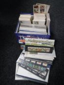 A box of first day covers and presentation packs