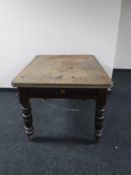 A Victorian pine kitchen table fitted a drawer