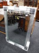 A frameless two tone sectional mirror