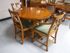 An inlaid yew wood six piece dining room suite