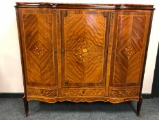 A continental inlaid Kingwood and gilt metal mounted serpentine-front sideboard,
