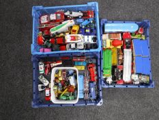 Three plastic trays containing assorted die cast vehicles
