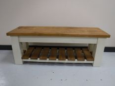 A reclaimed pine bench with under shelf,