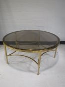 Two circular brass and glass topped coffee tables