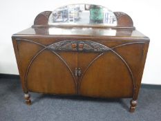 An oak mirror backed sideboard