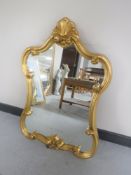An ornate gilded framed mirror