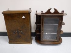 A mahogany glazed door curio cabinet and a wall cabinet