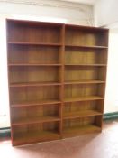 A pair of teak open bookshelves CONDITION REPORT: In good condition.