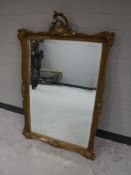 An ornate gilt framed mirror