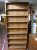 A set of narrow teak open shelves