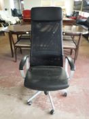 A high back swivel office armchair