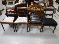 Four antique mahogany dining chairs