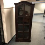 A glazed display cabinet with domed top,