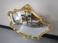 An ornate gilded framed mirror