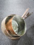 Three 19th century copper pans with cast iron handles